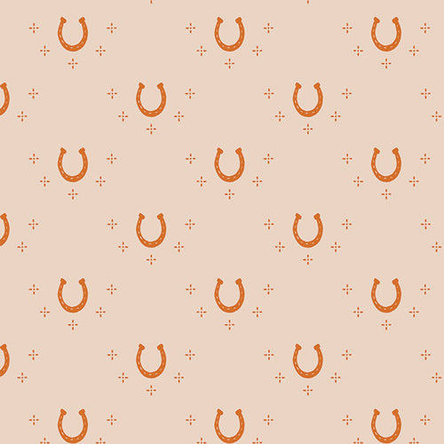 Pattern of horseshoes on a beige background